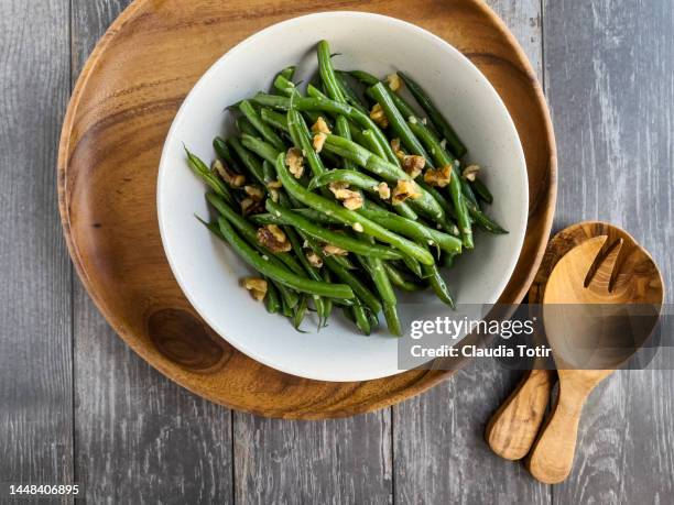 bowl of green beans salad on wooden gray wooden background - haricot vert photos et images de collection