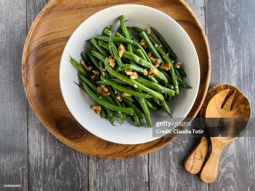 Bowl of green beans salad on wooden gray wooden background