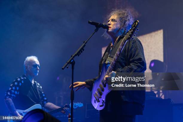 Reeves Gabrels and Robert Smith of The Cure perform at OVO Arena Wembley on December 11, 2022 in London, England.