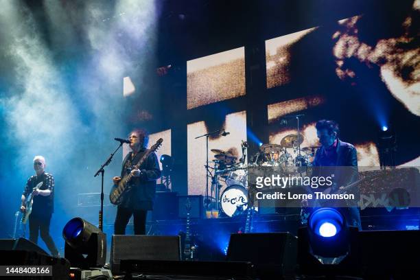 Reeves Gabrels, Robert Smith and Simon Gallup of The Cure perform at OVO Arena Wembley on December 11, 2022 in London, England.