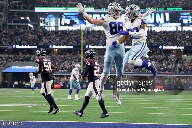 Tony Pollard of the Dallas Cowboys celebrates with Dalton Schultz of the Dallas Cowboys after scoring a touchdown in the second quarter of a game...