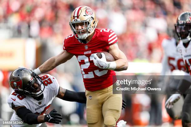 Christian McCaffrey of the San Francisco 49ers stiff arms Logan Ryan of the Tampa Bay Buccaneers during an NFL football game between the San...