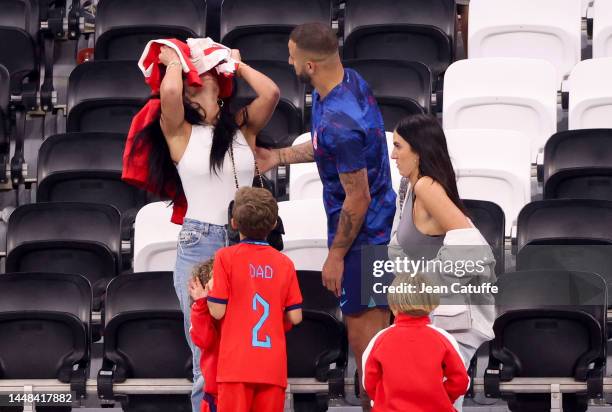 Kyle Walker of England and his wife Annie Kilner - hiding below a sweatshirt - following the FIFA World Cup Qatar 2022 quarter final match between...