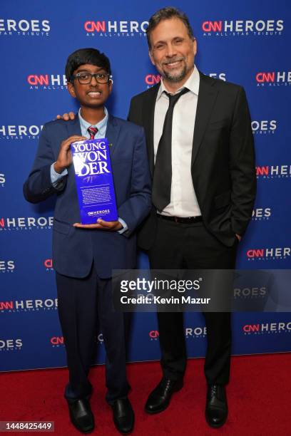 Young Wonder Sri Nihal Tammana poses with an award backstage with Jeremy Sisto during the 16th annual CNN Heroes: An All-Star Tribute at the American...