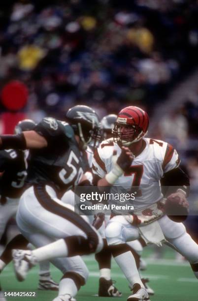 Quarterback Boomer Esiason of the Cincinnati Bengals looks to pass the ball in the game between the Cincinnati Bengals vs the Philadelphia Eagles at...