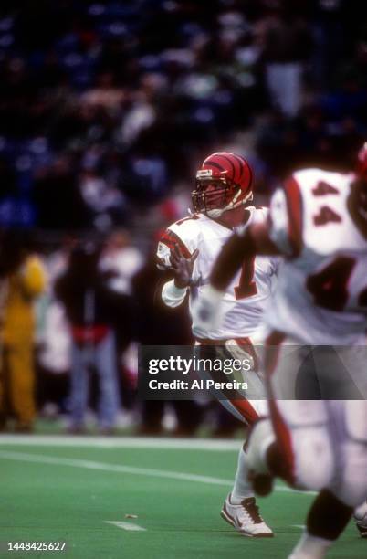 Quarterback Boomer Esiason of the Cincinnati Bengals looks to pass the ball in the game between the Cincinnati Bengals vs the Philadelphia Eagles at...