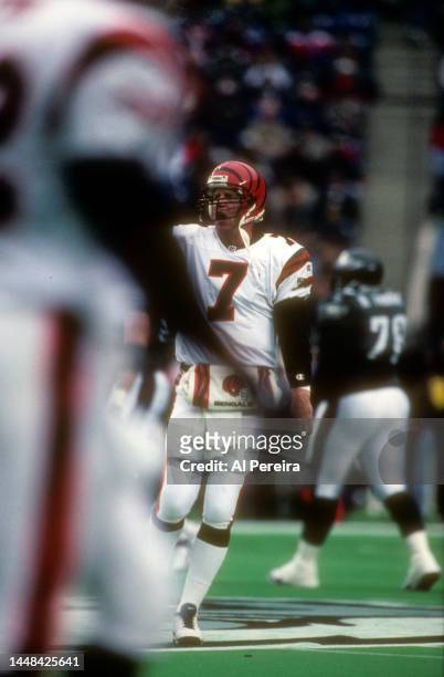 Quarterback Boomer Esiason of the Cincinnati Bengals walks off the field to the bench in the game between the Cincinnati Bengals vs the Philadelphia...