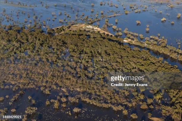 An aerial view of the village of Tilpa and the Tilpa pub surrounded by flood water on December 09, 2022 in Tilpa, Australia. Rainfall over recent...