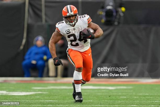 Nick Chubb of the Cleveland Browns runs with the ball in the fourth quarter against the Cincinnati Bengals at Paycor Stadium on December 11, 2022 in...