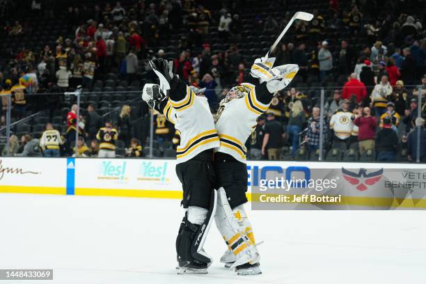 The Boston Bruins celebrate after defeating the Vegas Golden Knights at T-Mobile Arena on December 11, 2022 in Las Vegas, Nevada.