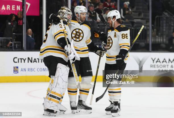 The Boston Bruins celebrate after defeating the Vegas Golden Knights at T-Mobile Arena on December 11, 2022 in Las Vegas, Nevada.