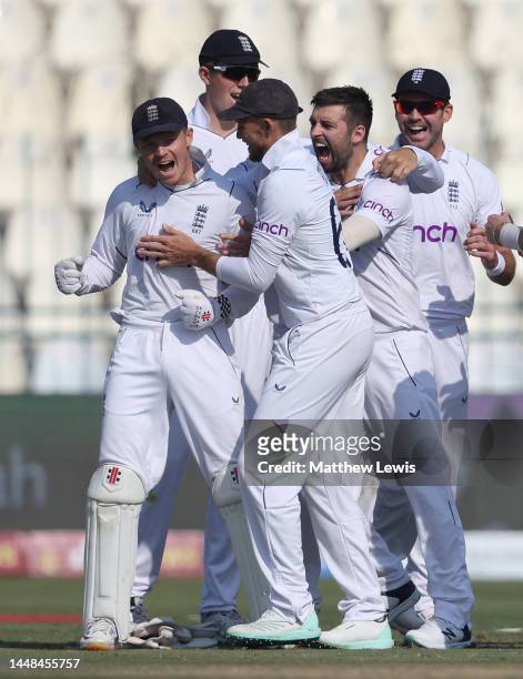 Mark Wood of England celebrates with Ollie Pope, Joe Root and James Aderson after dismissing Saud Shakeel of Pakistan during the Second Test Match...