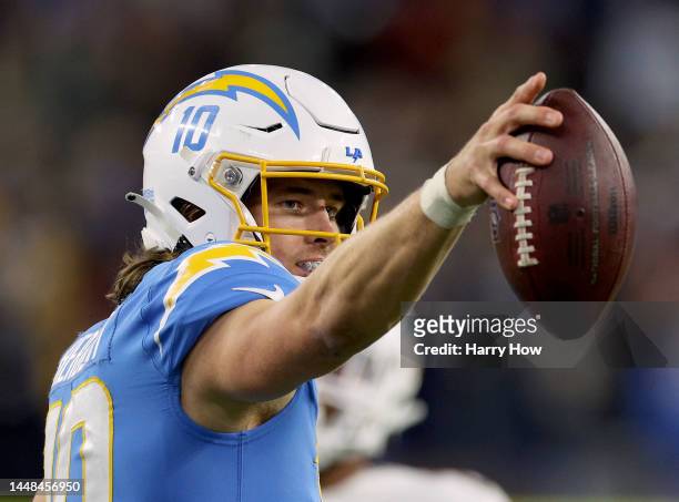Justin Herbert of the Los Angeles Chargers celebrates his run for a first down during the fourth quarter in a 23-17 win over the Miami Dolphins at...