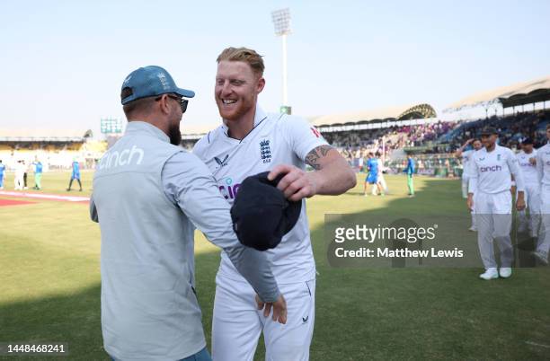 England captain Ben Stokes celebrates with coach Brendon McCullum after winning the Second Test Match between Pakistan and England at Multan Cricket...