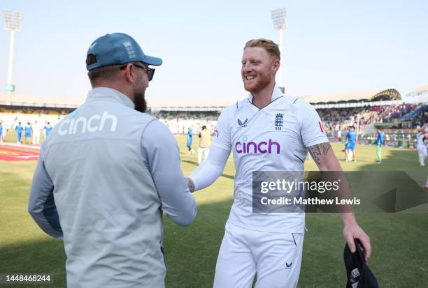 England captain Ben Stokes celebrates with coach Brendon McCullum after winning the Second Test Match between Pakistan and England at Multan Cricket...