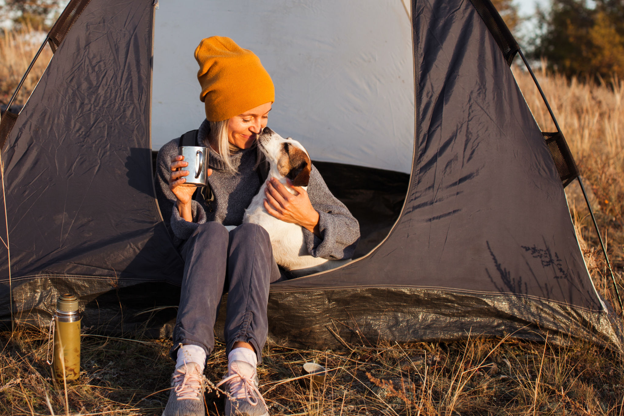 Middle aged woman in tent at campsite Middle aged woman in tent at campsite