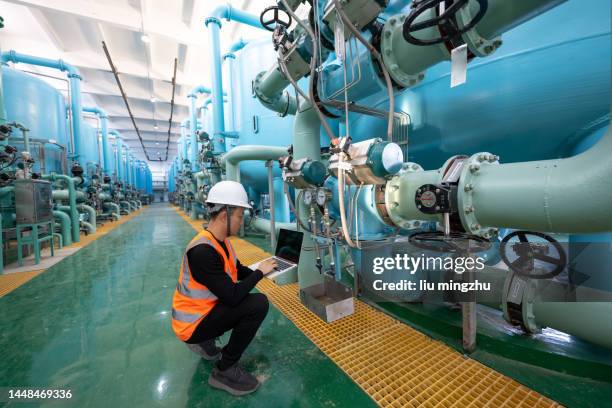 chemical plant engineer checking equipment with laptop - fermentation tank stock pictures, royalty-free photos & images