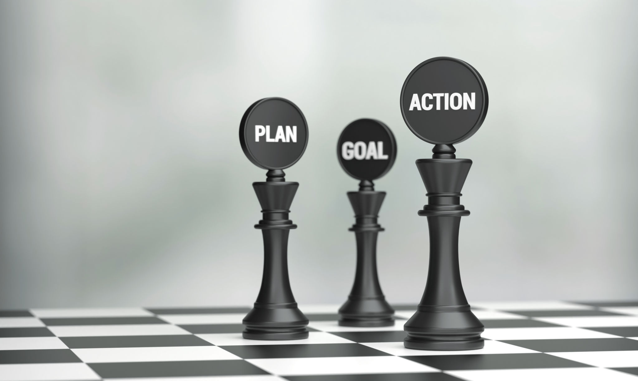 Chess pieces with Plan Action Goal written on the chessboard Chess pieces with Plan Action Goal written on the chessboard