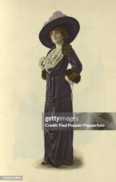 Colour plate from La Mode Illustree showing a woman wearing a city outfit by designer Francis, the two piece outfit is in purple velvet trimmed with...