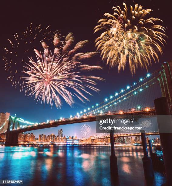 manhattan bridge with fireworks - new years eve new york city stock pictures, royalty-free photos & images