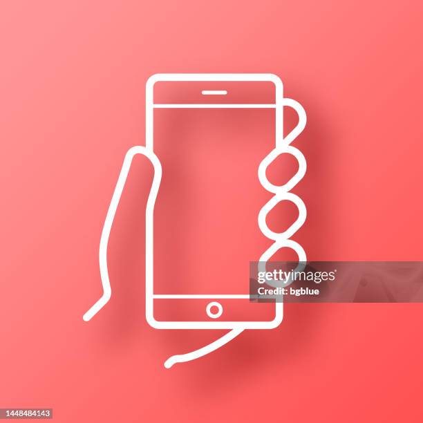 illustrations, cliparts, dessins animés et icônes de mains tenant le téléphone portable. icône sur fond rouge avec ombre - paper cut