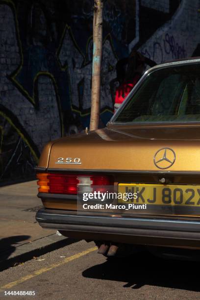 close-up of a mercedes benz 250 parked on the road - stock photo car chrome bumper stock pictures, royalty-free photos & images