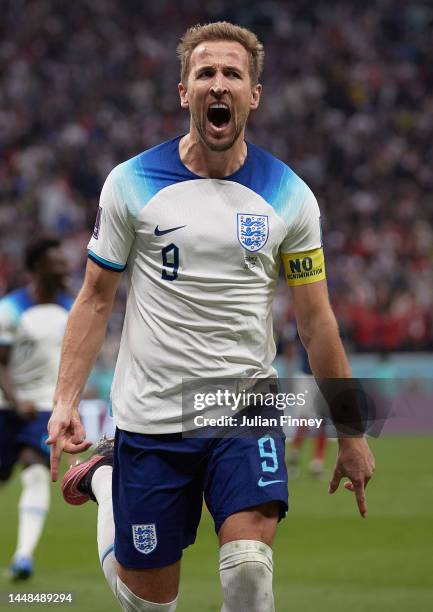 Harry Kane of England celebrates scoring their teams first goal from the penalty spot during the FIFA World Cup Qatar 2022 quarter final match...