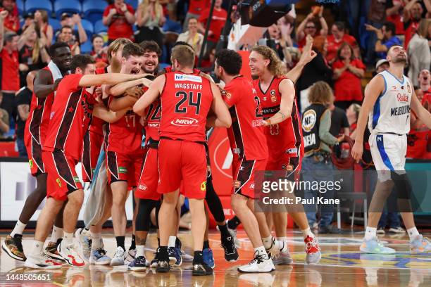 Team get around Corey Webster of the Wildcats after winning the round 10 NBL match between Perth Wildcats and Melbourne United at RAC Arena, on...