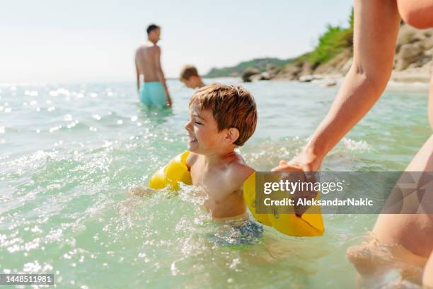 beach day - arm band stock pictures, royalty-free photos & images