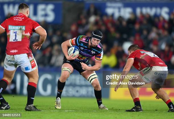 Adam Beard of Ospreys goes into contact during the Heineken Champions Cup match between Ospreys and Leicester Tigers at Swansea.com Stadium on...