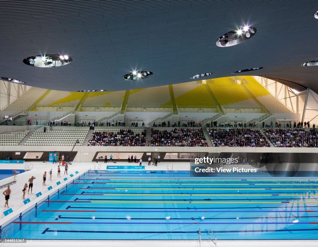 London Aquatic CentreLondon, E9, United Kingdom Architect:  Zaha Hadid Architects 2011 London Aquatic Centre, Zaha Hadid Architects, London, Uk, 2011, View Of Swimming Pool With People