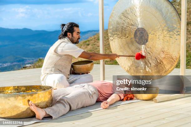 Man Ringing Gong Gong Loop Age Photos and Premium High Res Pictures - Getty Images