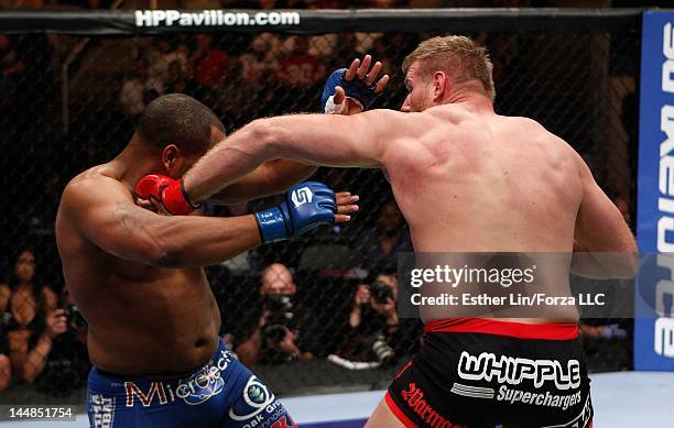 Josh Barnett punches Daniel Cormier during the Strikeforce event at HP Pavilion on May 19, 2012 in San Jose, California.