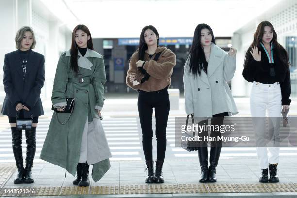 Yeji, Lia, Ryujin, Chaeryeong and Yuna of girl group ITZY are seen on departure at Incheon International Airport on December 12, 2022 in Incheon,...