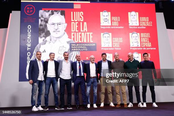 Luis de la Fuente and his team pose for photo during his presentation as new head coach of Spain football team at Ciudad del Futbol on december 12 in...