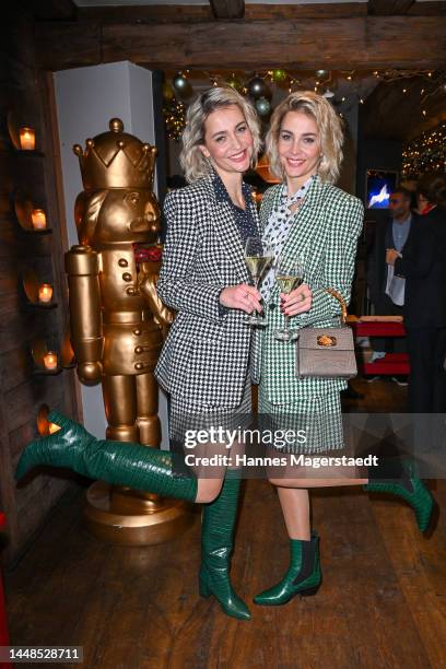 Julia Meise and Nina Meise attend the Christmas Charity Lunch at Käfer Wiesn-Schänke on December 12, 2022 in Munich, Germany.