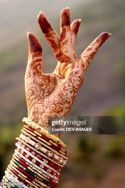 hand with beautiful henna tattoo - henna hands stock-fotos und bilder