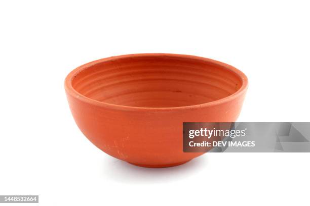 terracotta bowl on white background - tongeschirr stock-fotos und bilder