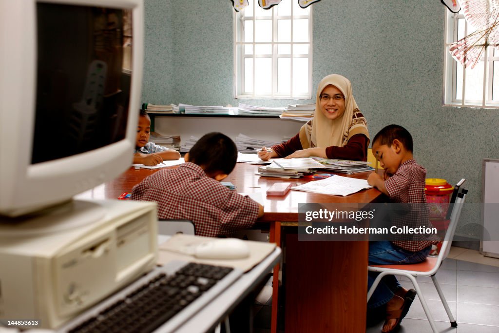 Malaysian Schoolteacher and Pupils