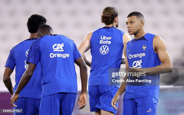 Kylian Mbappe of France looks on during France Training Session at Al Sadd SC Stadium on December 12, 2022 in Doha, Qatar.