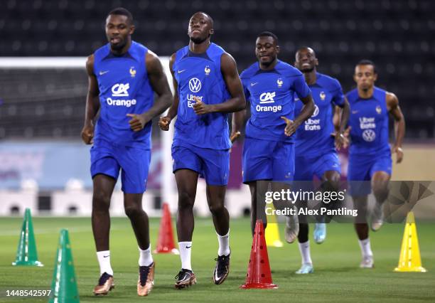 Ibrahima Konate of France warms up during France Training Session at Al Sadd SC Stadium on December 12, 2022 in Doha, Qatar.