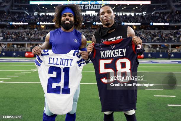 Running back Ezekiel Elliott of the Dallas Cowboys and linebacker Christian Kirksey of the Houston Texans exchange jerseys after the Cowboys beat the...