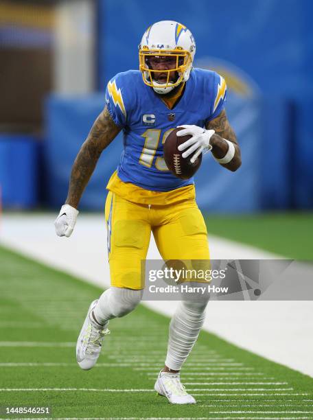 Keenan Allen of the Los Angeles Chargers runs after his catch during a 23-17 win over the Miami Dolphins at SoFi Stadium on December 11, 2022 in...