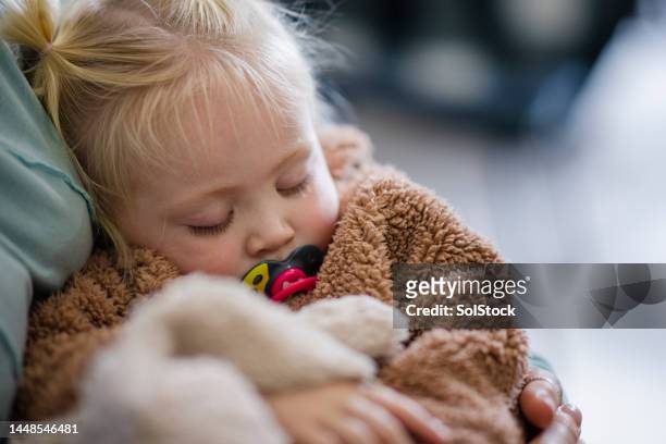 sleeping comfortably - family support stock pictures, royalty-free photos & images