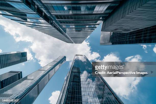 low angle view of tall corporate buildings skyscrapers - building low angle stockfoto's en -beelden