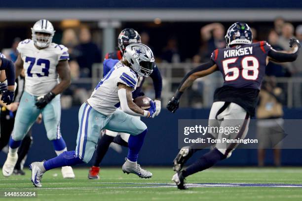 Running back Ezekiel Elliott of the Dallas Cowboys carries the ball against linebacker Christian Kirksey of the Houston Texans in the fourth quarter...