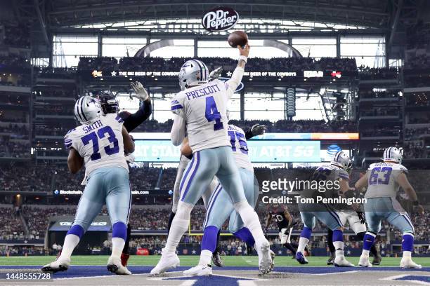 Quarterback Dak Prescott of the Dallas Cowboys looks for an open receiver against the Houston Texans in the fourth quarter at AT&T Stadium on...
