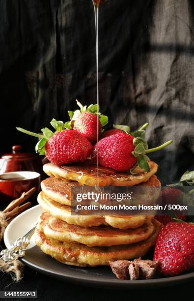 close-up of pancakes with pancakes on table - buttermilch stock-fotos und bilder