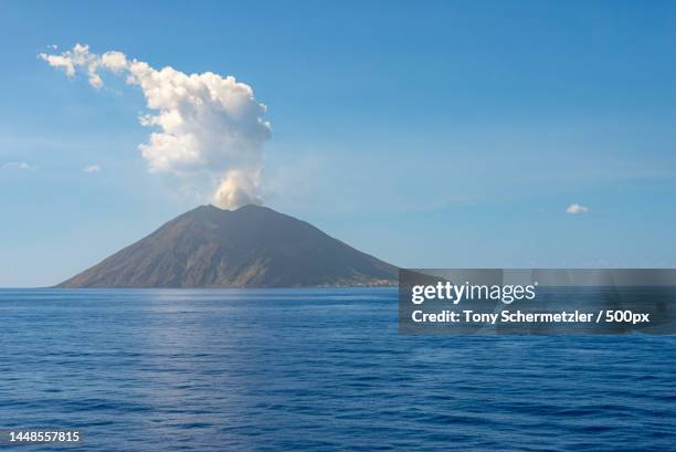 scenic view of sea against blue sky,metropolitan city of messina,italy - volcanic activity fotografías e imágenes de stock