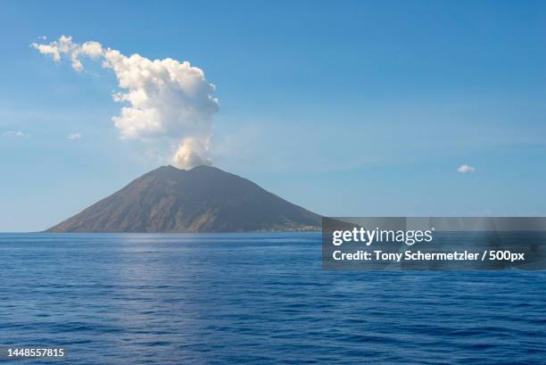 scenic view of sea against blue sky,metropolitan city of messina,italy - volcanic activity - fotografias e filmes do acervo